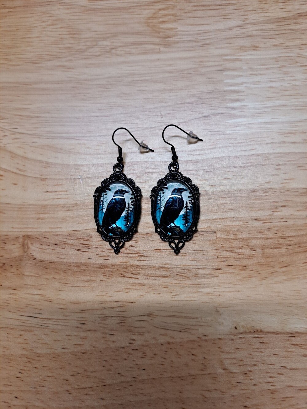 Vintage Style Black Raven Earrings with Blue Background